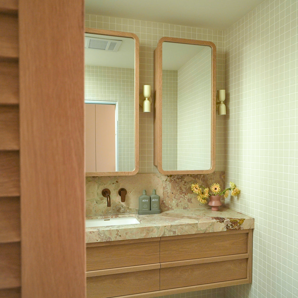 Darren Palmer's Modern Ensuite Bathroom - Sleek Stone Surfaces with Terracotta Vase and Elegant Fixtures